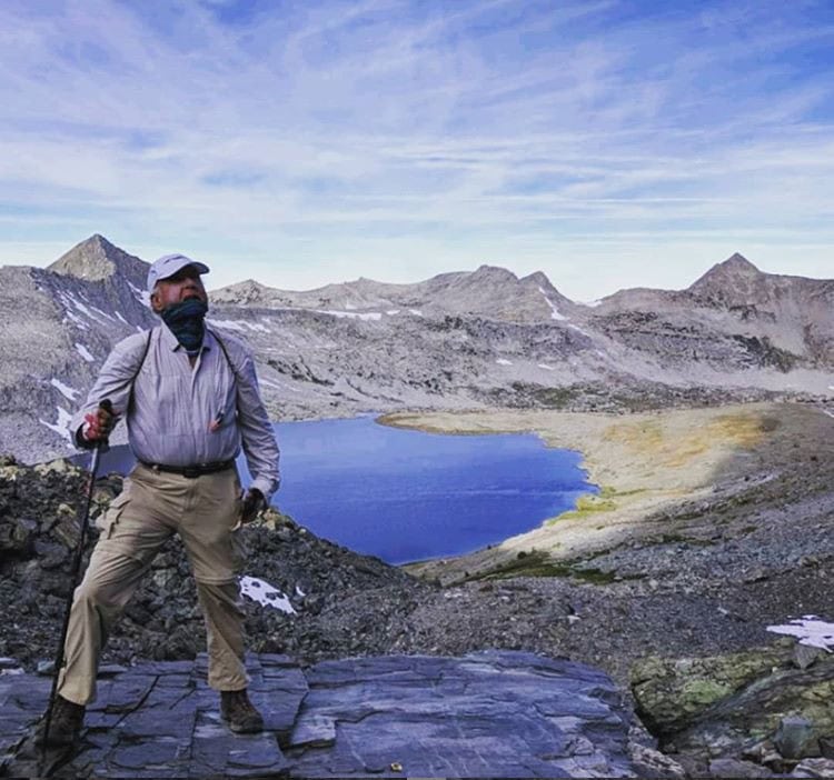 Man looking at Mt. Goddard on TSX Challenge trek.